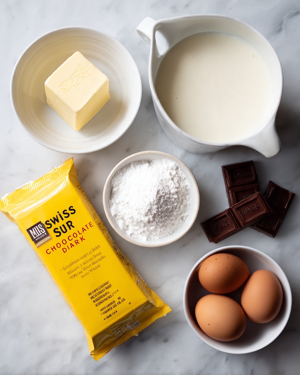 The image shows five groups of baking ingredients placed on a white marbled surface: at the top right, there is a large white measuring jug filled with cream; to the left of it, a small white bowl with a square block of pale yellow butter; below that, a small white bowl holding three brown eggs; next to it on the left side, a bright yellow rectangular package labeled